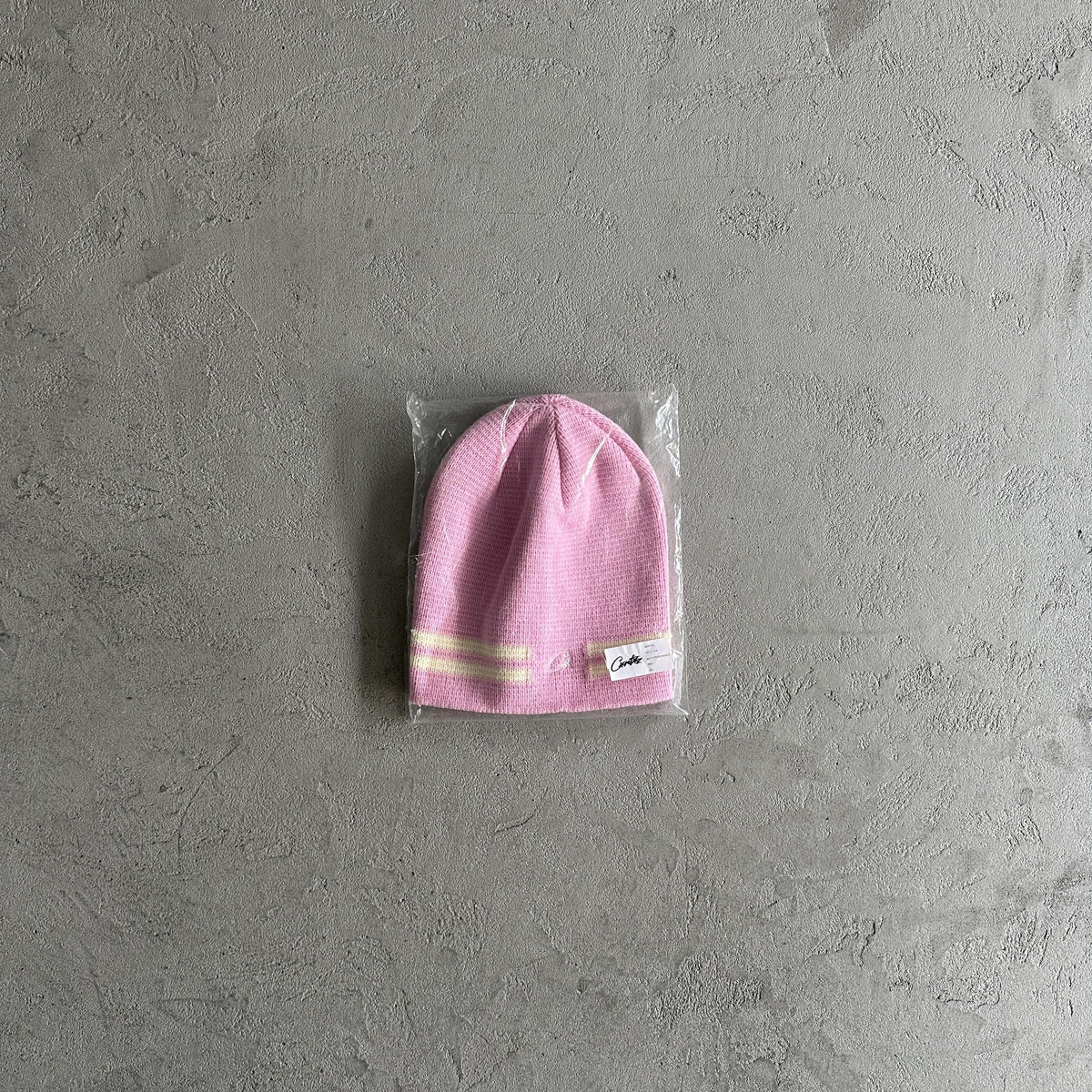 Bonnet à rayures en tricot Corteiz - Rose