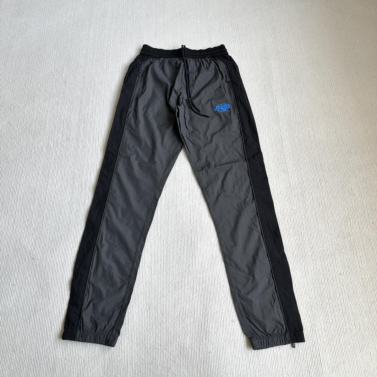 Équipe de survêtements Synaworld